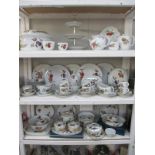 A large quantity on 3 shelves of Royal Worcester 'Evesham' dinnerware