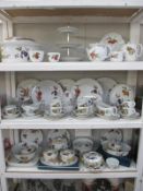 A large quantity on 3 shelves of Royal Worcester 'Evesham' dinnerware