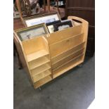 A plywood library trolley (a shelf & bar missing)