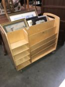 A plywood library trolley (a shelf & bar missing)