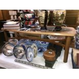 A coffee table with oval glass insert