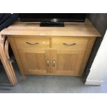 A solid oak 2 drawer cupboard