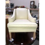 A classical designed leather style comfy armchair in soft beige
