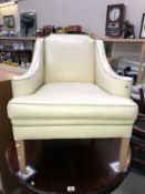 A classical designed leather style comfy armchair in soft beige