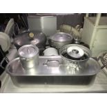 A quantity of aluminium kitchen pans and a vintage Presto pressure cooker.