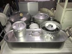 A quantity of aluminium kitchen pans and a vintage Presto pressure cooker.