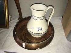 An old beaten copper dish and a good English pottery jug.