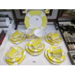 An art deco style yellow tea set marked English china