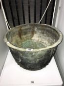 A large copper cauldron,