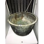 A large copper cauldron,