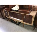 A 1970's teak effect melamine sideboard