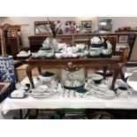 A large quantity of Denby Green Wheat dinner & tea set