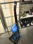 A Hoover 2000W upright vacuum cleaner.