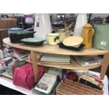 A light wood effect oval coffee table.