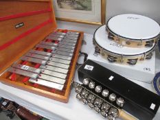 A Karma Glockenspiel, sleigh bells and 2 tambourines,