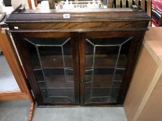 A 2 door leaded glass display cabinet top