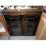 A 2 door leaded glass display cabinet top