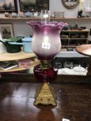 An oil lamp with ruby glass font