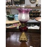 An oil lamp with ruby glass font