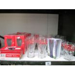 A large quantity of retro coca cola glasses etc.