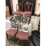 A set of 4 mahogany shield back dining chairs with pin draylon seats.