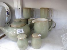 A Denby stoneware teapot, 6 mugs etc.