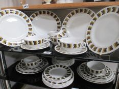 A vintage Ridgeway dinner service on 2 shelves