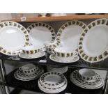 A vintage Ridgeway dinner service on 2 shelves