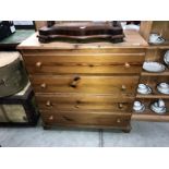 A solid pine chest of drawers