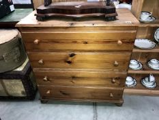 A solid pine chest of drawers