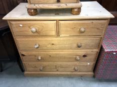 A solid pine chest of drawers