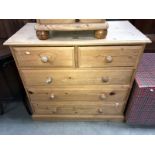 A solid pine chest of drawers