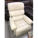 A cream leather recliner chair