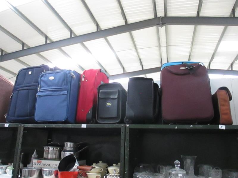 A quantity of suitcases etc.