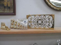 2 sets of solid brass weights and a trivet