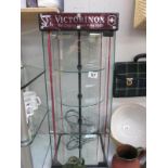 A light up display cabinet with revolving shelves