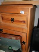 A solid pine bedside cabinet