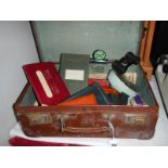 An interesting case full of misc. items including miniature binoculars etc.
