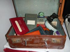 An interesting case full of misc. items including miniature binoculars etc.