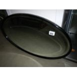 An Edwardian oval mirror