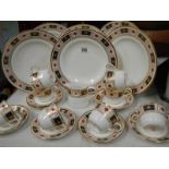 A Royal Crown Derby tea set and plates