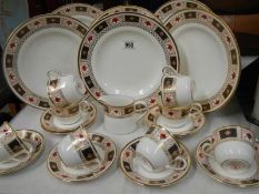 A Royal Crown Derby tea set and plates