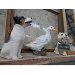 2 dogs and a duck sculpture