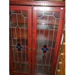 A 2 door glazed cabinet