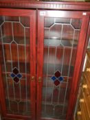 A 2 door glazed cabinet