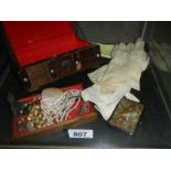 A jewellery box including costume jewellery, compact, silver handled nail tool,