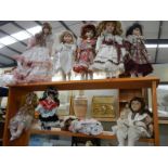 2 shelves of collectors dolls