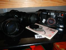 A Canon camera, case,