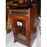 An old oak smokers cabinet