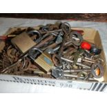 A tray of old locks and keys